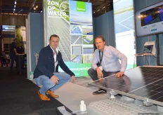 Willem Verwoerd of Zon op Waterbassin and Chretien Hendriks of Genap at the collaboratively developed system. In the foreground, the talus cloth is attached to the floating solar panels as an anchor.